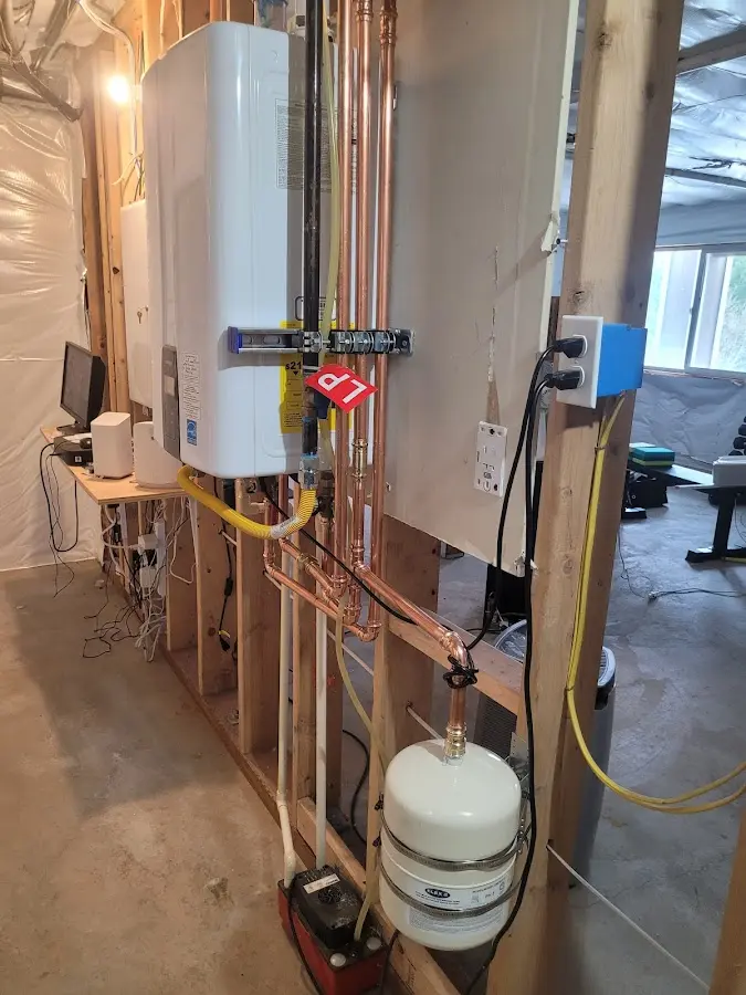 Licensed plumber repairing a kitchen sink in Whitney